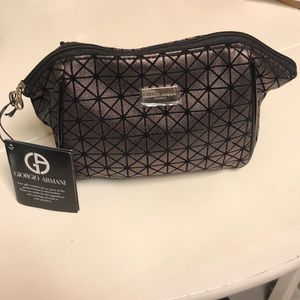 Giorgio Armani cosmetic bag with zipper.